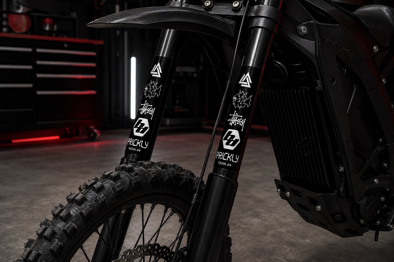 Sur-Ron style e-moto fork guards fitted with Fork Decal YBM Customs